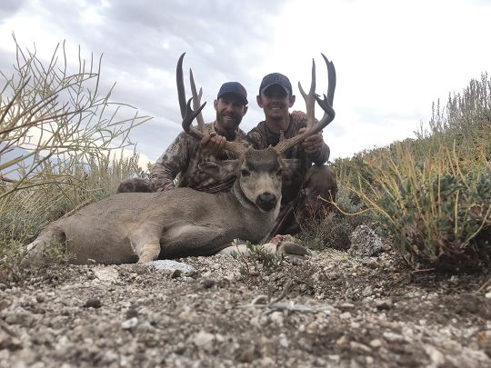 Tyler Dennison (right) and his hunting buddy Cody Darling show off the tremendous X9b Inyo mule deer shot on opening day of the 2017 California deer season after more than two months of backcountry scouting.